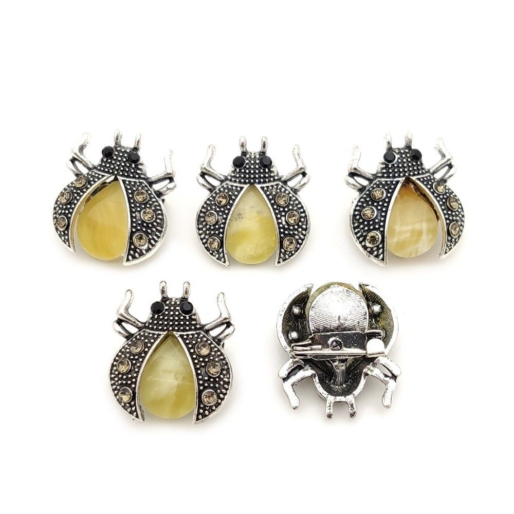 Брошь "Жук" янтарь